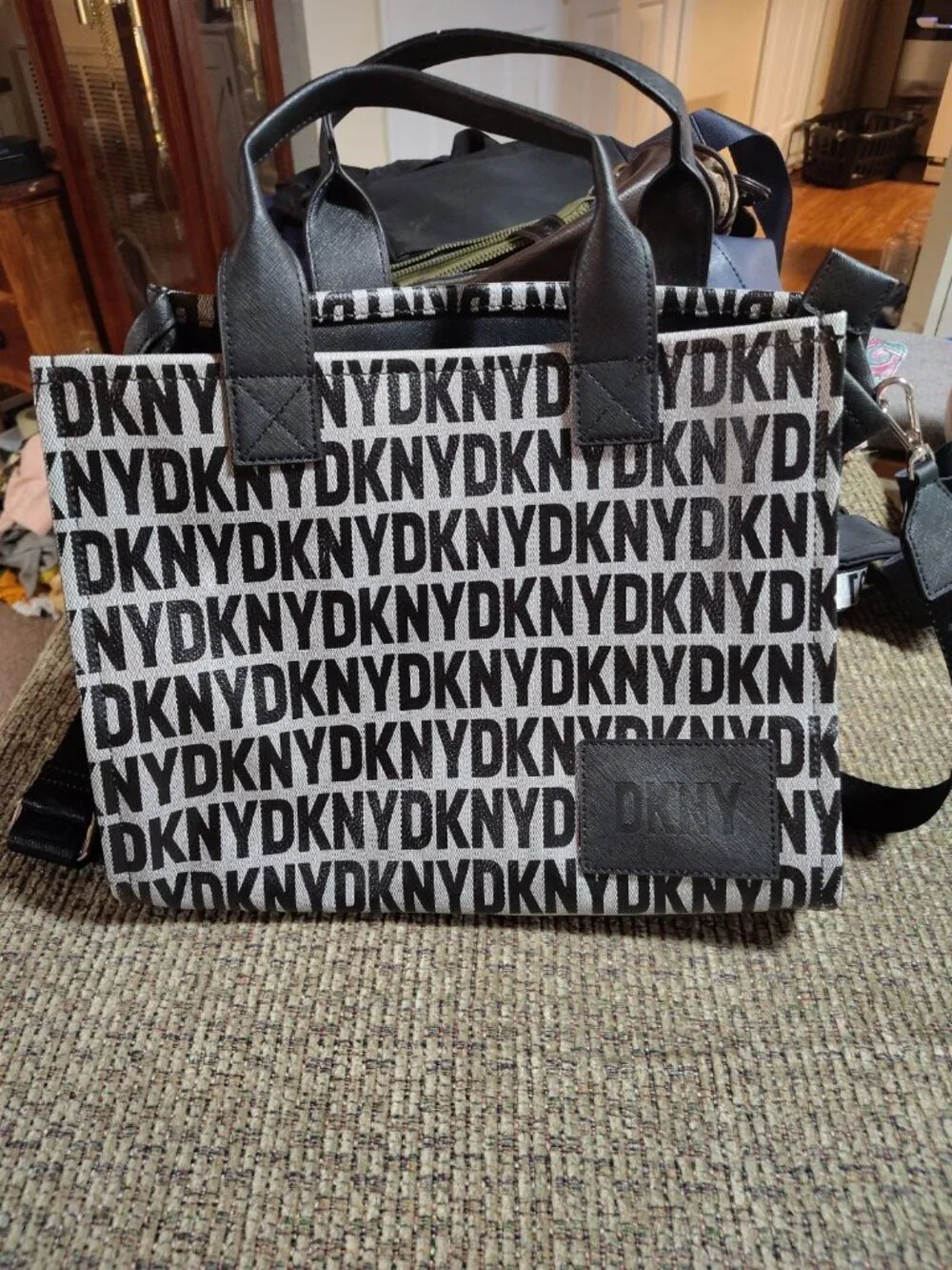 DKNY Hadlee tote bag featuring an all-over logo-print and a black leather Patch